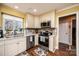 Kitchen with stainless steel appliances and cream-colored cabinets at 1713 12Th Ne St, Hickory, NC 28601