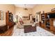 Bright living room with high ceilings, hardwood floors, a fireplace and wood accents, bookshelves and comfortable seating at 1713 12Th Ne St, Hickory, NC 28601