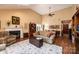 Spacious living room with hardwood floors, vaulted ceiling, a fireplace, and open access to dining area at 1713 12Th Ne St, Hickory, NC 28601