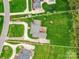 Aerial view showing the property lines of a beautifully landscaped home with circular driveway, set on a green lot at 1902 Windmere Dr, Monroe, NC 28110
