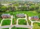 Stunning aerial view of well-maintained homes with lush lawns, mature trees, and access to Rolling Hills Country Club at 1902 Windmere Dr, Monroe, NC 28110