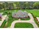 Expansive aerial view showing the home's well-manicured lawns, long driveway, and mature trees at 1902 Windmere Dr, Monroe, NC 28110