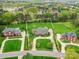 Stunning aerial view of well-maintained homes with lush lawns, mature trees, and access to Rolling Hills Country Club at 1902 Windmere Dr, Monroe, NC 28110