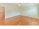 Bright bedroom with hardwood floors and neutral colored walls at 1902 Windmere Dr, Monroe, NC 28110