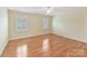 Bedroom featuring hardwood floors and bright, natural light at 1902 Windmere Dr, Monroe, NC 28110