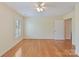 Bedroom with hardwood floors and natural light from the window at 1902 Windmere Dr, Monroe, NC 28110