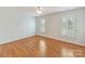 Empty bedroom with hardwood floors and natural light from the windows at 1902 Windmere Dr, Monroe, NC 28110