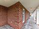 Covered front porch with brick accents and overhead lighting at 1902 Windmere Dr, Monroe, NC 28110