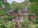 Brick home with an outdoor patio and landscaped backyard, perfect for entertaining or relaxing at 2313 Beechwood Dr, Waxhaw, NC 28173