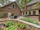Private backyard boasting a brick patio, fire pit, garden area, and an outdoor dining area at 2313 Beechwood Dr, Waxhaw, NC 28173