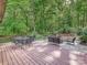 Spacious backyard deck featuring dining and seating area surrounded by a lush green landscape at 2313 Beechwood Dr, Waxhaw, NC 28173