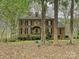 Traditional brick home with dark shutters, dormers, and mature landscaping at 2313 Beechwood Dr, Waxhaw, NC 28173