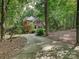 Charming brick home featuring mature trees and a long driveway through a landscaped front yard at 2313 Beechwood Dr, Waxhaw, NC 28173