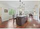 Open floor plan kitchen featuring a center island with barstool seating at 2313 Beechwood Dr, Waxhaw, NC 28173