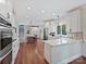 Spacious open kitchen with white cabinets, stainless appliances, and center island at 2313 Beechwood Dr, Waxhaw, NC 28173