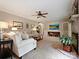 Comfortable living room featuring a TV, neutral tones, and a fireplace with brick surround at 2313 Beechwood Dr, Waxhaw, NC 28173