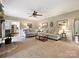 Spacious living room with neutral decor, wainscoting, and seamless transition to the kitchen at 2313 Beechwood Dr, Waxhaw, NC 28173