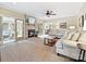 Comfortable living room featuring a brick fireplace, neutral tones, and access to a sunroom at 2313 Beechwood Dr, Waxhaw, NC 28173
