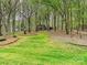 Lush front yard with healthy green grass and plenty of trees surrounding this beautiful home at 2313 Beechwood Dr, Waxhaw, NC 28173