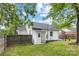 Backyard featuring a shed, well-maintained lawn, and wooden fence at 2414 Remount Rd, Charlotte, NC 28208