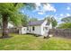 Well-maintained backyard featuring a shed, patio, and lush green lawn at 2414 Remount Rd, Charlotte, NC 28208