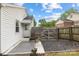 Backyard patio with outdoor seating and gravel, enclosed by wooden fence at 2414 Remount Rd, Charlotte, NC 28208