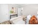 Cozy bedroom featuring modern decor, wood floors, and access to an adjoining room at 2414 Remount Rd, Charlotte, NC 28208