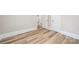 Hallway with wood floors and access to additional rooms via white doors at 2414 Remount Rd, Charlotte, NC 28208