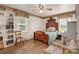 Charming bedroom with hardwood floors, ceiling fan, and a lovely window view at 252 Stamey Farm Rd, Statesville, NC 28677