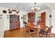 Cozy dining room with hardwood floors, charming decor, vintage chandelier creating a warm inviting atmosphere at 252 Stamey Farm Rd, Statesville, NC 28677