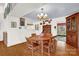 Warm dining room with hardwood floors, traditional furnishings, and vintage chandelier for inviting meals at 252 Stamey Farm Rd, Statesville, NC 28677