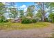 Charming home with a sunroom and driveway, set against a backdrop of mature trees at 252 Stamey Farm Rd, Statesville, NC 28677