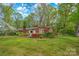 Attractive brick home with well-maintained lawn and colorful azalea bushes adding curb appeal at 252 Stamey Farm Rd, Statesville, NC 28677