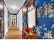 Hallway featuring hardwood floors and blue floral wallpaper at 252 Stamey Farm Rd, Statesville, NC 28677