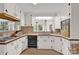 Bright kitchen with vintage appliances, white cabinetry, wood-trimmed countertops and eat-in breakfast nook at 252 Stamey Farm Rd, Statesville, NC 28677
