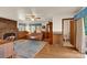 Cozy living room with hardwood floors, a brick fireplace, and vintage furnishings at 252 Stamey Farm Rd, Statesville, NC 28677