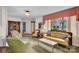 Cozy living room with large windows, plush seating, and classic chandelier offering a relaxing atmosphere at 252 Stamey Farm Rd, Statesville, NC 28677