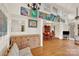 Cozy living area with hardwood floors, vintage chandelier, and ample natural light coming from clerestory windows at 252 Stamey Farm Rd, Statesville, NC 28677