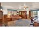 Cozy living room with hardwood floors, a brick fireplace, and vintage furnishings at 252 Stamey Farm Rd, Statesville, NC 28677