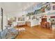 Bright living room with hardwood floors, large windows, and vaulted ceilings, leading into a dining area at 252 Stamey Farm Rd, Statesville, NC 28677