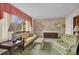 Comfortable living room featuring a serene mural backdrop and a large window for natural light at 252 Stamey Farm Rd, Statesville, NC 28677