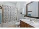 Well-lit bathroom with a shower-tub combo, vanity and coordinated fixtures at 2934 Selwyn Ave, Charlotte, NC 28209