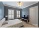 Cozy bedroom featuring a comfortable bed, neutral colors, and plenty of natural light at 2934 Selwyn Ave, Charlotte, NC 28209
