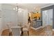 Bright dining area with a glass table and comfortable chairs near the kitchen at 2934 Selwyn Ave, Charlotte, NC 28209