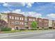 Exterior of brick condo building at Selwyn Terrace with beautiful architectural details and landscaping at 2934 Selwyn Ave, Charlotte, NC 28209