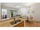 Open kitchen with granite counters flowing into dining and living areas at 2934 Selwyn Ave, Charlotte, NC 28209