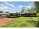 Lush backyard with mature trees, manicured lawn, and a covered parking area adding convenience and charm at 3000 Imperial Dr, Gastonia, NC 28054