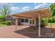 Brick ranch with covered carport and large parking area with mature landscaping and screened in porch at 3000 Imperial Dr, Gastonia, NC 28054