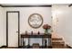 Inviting foyer with decorative wall art, elegant console table, and warm lighting at 3000 Imperial Dr, Gastonia, NC 28054