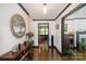 Elegant foyer featuring hardwood floors, tasteful decor, and a glimpse into the living room at 3000 Imperial Dr, Gastonia, NC 28054